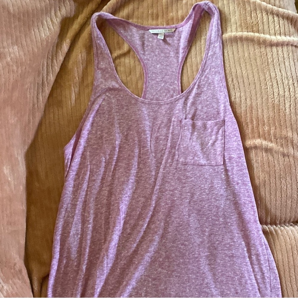 Victoria’s Secret Racerback tank top. Longer, can also be a swim suit cover